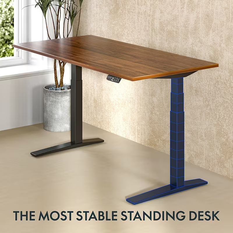 Wooden standing desk with adjustable height on a beige floor, next to a window with plants.